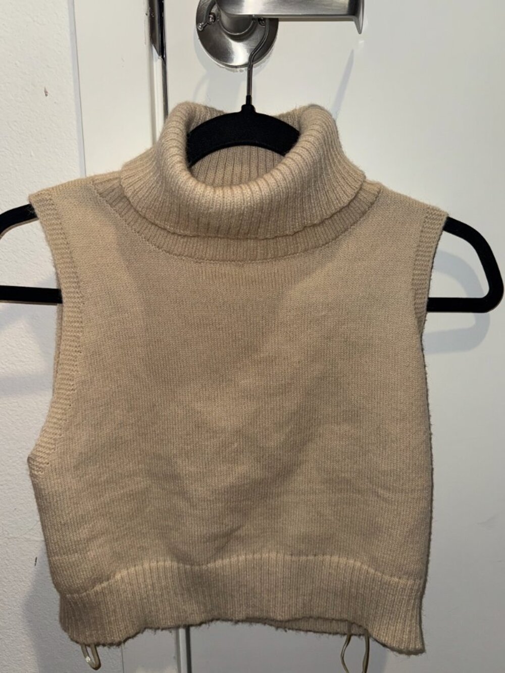 Cropped sleeveless cowl neck sweater